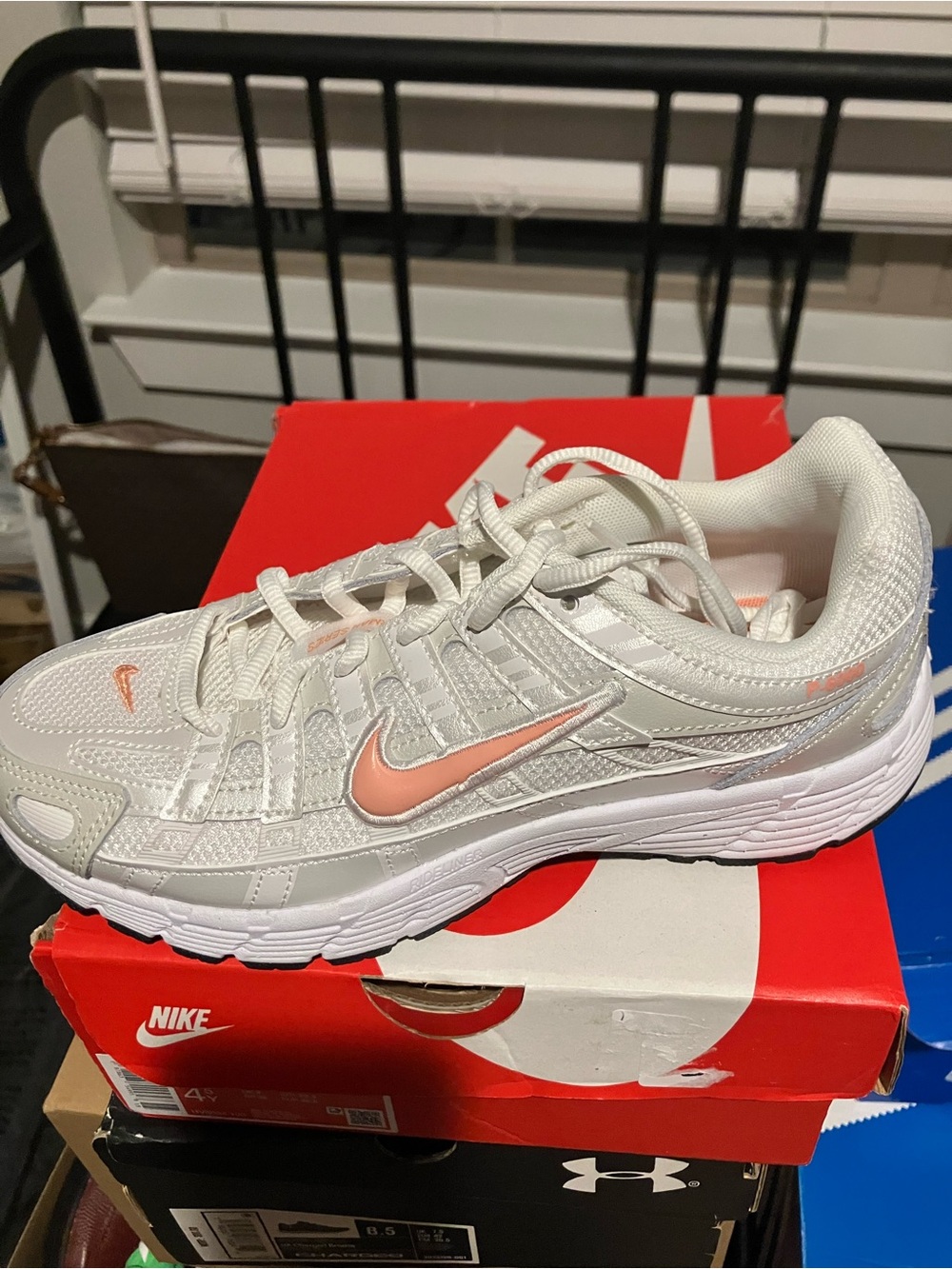 Nike Women’s White Athletic Shoes with Pink Swoosh